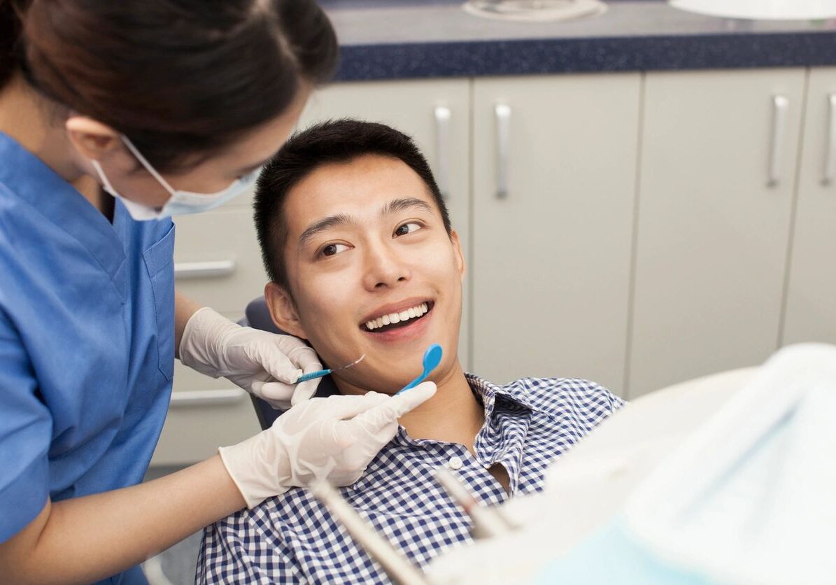 hygienist taking care of patient